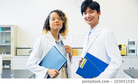 Multinational group in white coats Multinational group in white coats 103051585