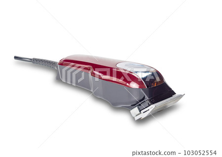 Side view closeup of professional single red corded electric hairclipper. 103052554
