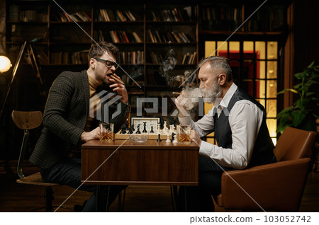 Family of intelligent people playing chess, smoking cigars and drinking whiskey Family of intelligent people playing chess, smoking cigars and drinking whiskey 103052742