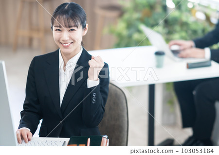 Young career woman with guts pose 103053184
