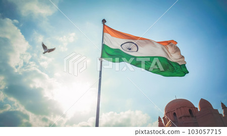 The National Tricolor Flag of India is waving against a blue sky. Banner for Indian Independence Day national holiday The National Tricolor Flag of India is waving against a blue sky. Banner for Indian Independence Day national holiday 103057715