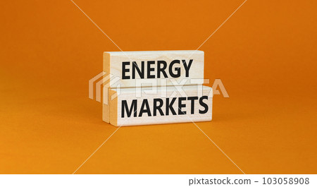 Energy markets symbol. Concept words Energy markets on wooden block. Beautiful orange table orange background. Business energy markets concept. Copy space. Energy markets symbol. Concept words Energy markets on wooden block. Beautiful orange table orange background. Business energy markets concept. Copy space. 103058908
