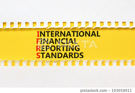 IFRS symbol. Concept words IFRS international financial reporting standards on paper on beautiful white background. Business IFRS international financial reporting standards concept. Copy space. 103058911