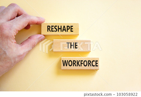 Reshape the workforce and support symbol. Concept words Reshape the workforce on wooden blocks. Businessman hand. Beautiful white background. Business reshape the workforce quote concept. Copy space Reshape the workforce and support symbol. Concept words Reshape the workforce on wooden blocks. Businessman hand. Beautiful white background. Business reshape the workforce quote concept. Copy space 103058922