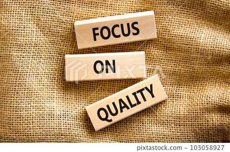 Focus on quality symbol. Concept words Focus on quality on blocks on beautiful canvas table canvas background. Business, focus on quality concept. Copy space. Focus on quality symbol. Concept words Focus on quality on blocks on beautiful canvas table canvas background. Business, focus on quality concept. Copy space. 103058927