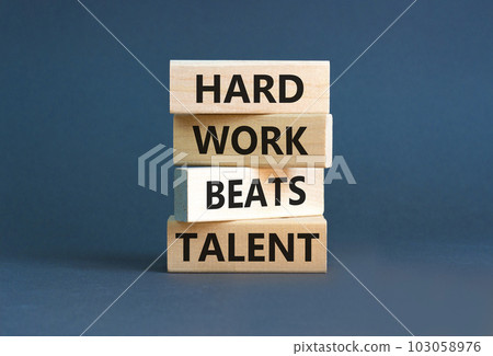 Hard work beats talent symbol. Concept words Hard work beats talent on wooden block. Beautiful grey table grey background. Motivational business hard work beats talent concept. Copy space. 103058976