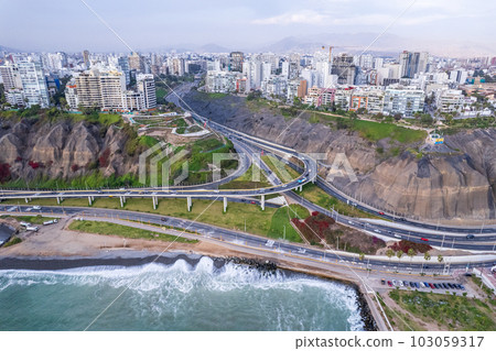 Aerial view of La Costa Verde and the Miraflores boardwalk in Lima. Aerial view of La Costa Verde and the Miraflores boardwalk in Lima. 103059317