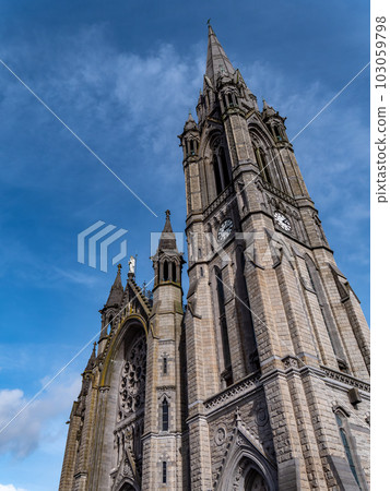 Catholic Cathedral in Ireland, Gothic style. The Cathedral Church of St Colman known as Cobh Cathedral, or Queenstown Cathedral, single-spire cathedral. Roman Catholic cathedral. Catholic Cathedral in Ireland, Gothic style. The Cathedral Church of St Colman known as Cobh Cathedral, or Queenstown Cathedral, single-spire cathedral. Roman Catholic cathedral. 103059798