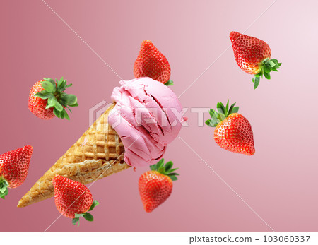 Strawberry ice cream in a waffle cone with falling fresh berries. Strawberry ice cream in a waffle cone with falling fresh berries. 103060337