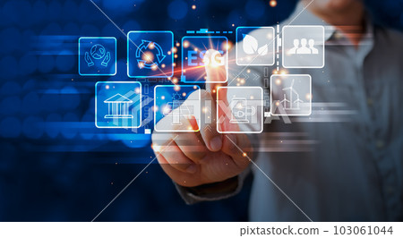 person are toch the screen to green energy,and reduce global warming,idea for environment conscious business,carbon credit,reducing greenhouse gas emissions,ESG for Environment Social and Governance 103061044