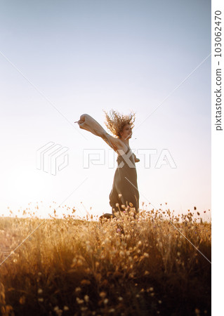 Young woman resting in nature. People, lifestyle, relaxation and vacations concept. Fashion. 103062470