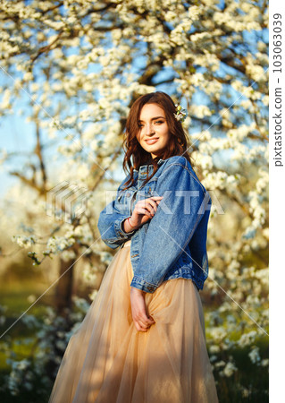 Portrait of a beautiful bride. Wedding concept. Stylish wedding. Great sunset light. Spring garden. 103063039