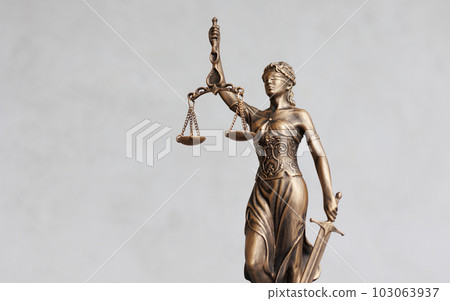 themis is goddess of justice statuette on dark background. symbol of law with scales themis is goddess of justice statuette on dark background. symbol of law with scales 103063937