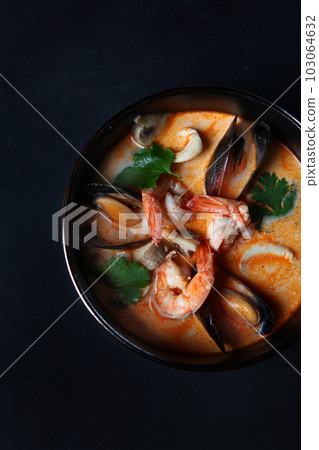 Tom Yum Soup.Traditional thai asian spicy coconut milk soup with shrimps . Top view, copy space. Tom Yum Soup.Traditional thai asian spicy coconut milk soup with shrimps . Top view, copy space. 103064632
