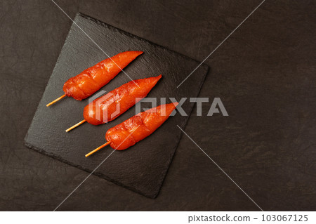 Fresh raw marinated chicken meat skewers iner fillet on a black background.Top view.Chicken fillet inner skewers.Food concept.Food for retail.Ogranic food,healthy eating. 103067125