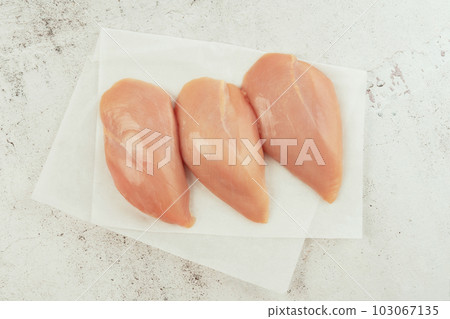 Raw fresh chicken fillet on a gray background.Copy space.Food for retail.Ogranic food,healthy eating.Food concept.Top view.Chicken breast Fillets.Close up.Raw chicken meat. Raw fresh chicken fillet on a gray background.Copy space.Food for retail.Ogranic food,healthy eating.Food concept.Top view.Chicken breast Fillets.Close up.Raw chicken meat. 103067135