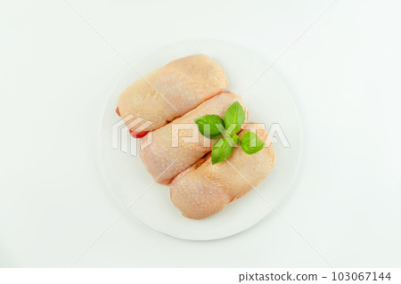 Food for retail.Procurement for designers.Ogranic food,healthy eating.Food concept.Top view.Chicken leg meat.Raw fresh chicken leg meat with skin on a light background with fresh herbs. Food for retail.Procurement for designers.Ogranic food,healthy eating.Food concept.Top view.Chicken leg meat.Raw fresh chicken leg meat with skin on a light background with fresh herbs. 103067144