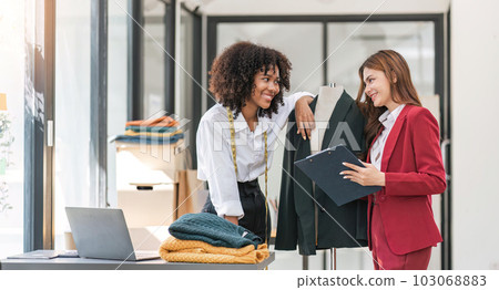 Creative fashion planning, teamwork or women designer for working, collaboration or help jacket design. Tailor, startup or small business team for clothing style, pattern or textile manufacturing Creative fashion planning, teamwork or women designer for working, collaboration or help jacket design. Tailor, startup or small business team for clothing style, pattern or textile manufacturing 103068883