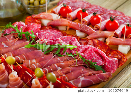 Assortment of sausages fuet, chorizo, jamon Assortment of sausages fuet, chorizo, jamon 103074649