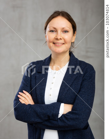 Portrait of smiling woman posing in jacket Portrait of smiling woman posing in jacket 103074814