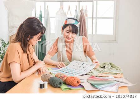 Stylist women having a costume meeting / conference Stylist women having a costume meeting / conference 103074817