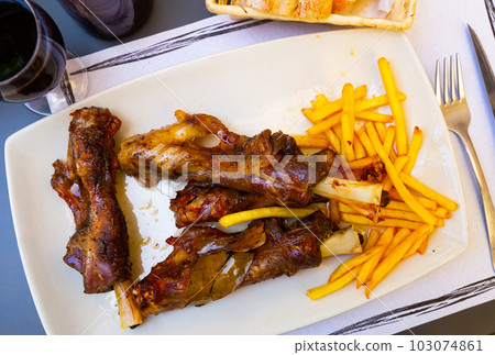 Lamb on the bone with potatoes. Spanish dish Lamb on the bone with potatoes. Spanish dish 103074861