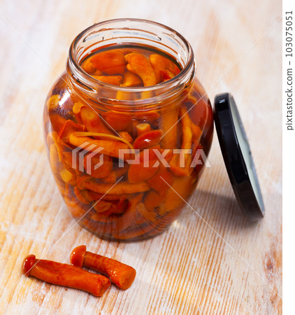 Marinated honey fungi in glass jar 103075051