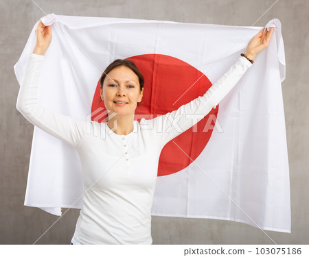 Positive girl with Japan flag rooting for your favorite team 103075186