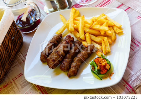 Grilled dish of minced meat Cevapcici Grilled dish of minced meat Cevapcici 103075223