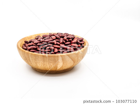The close-up raw pile of red beans in a round shape wooden bowl on white background. The clipping path around red beans in a wooden bowl in the file. The close-up raw pile of red beans in a round shape wooden bowl on white background. The clipping path around red beans in a wooden bowl in the file. 103077110