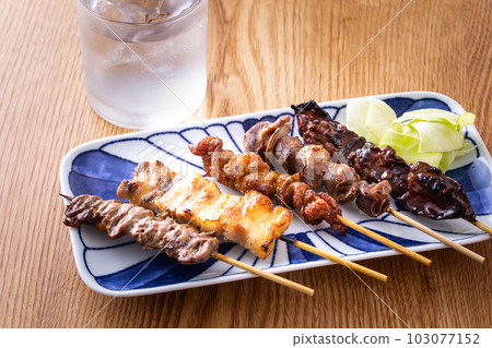 Assorted yakitori and shochu at an izakaya Assorted yakitori and shochu at an izakaya 103077152