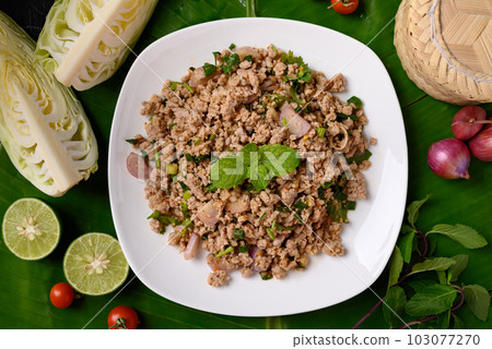 Local Thai food, Spicy minced pork salad (Larb Moo), Table top view Local Thai food, Spicy minced pork salad (Larb Moo), Table top view 103077270