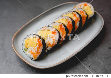 Close up sushi made with egg or tamago. Japanese food and cooking concept. Close up sushi made with egg or tamago. Japanese food and cooking concept. 103079161