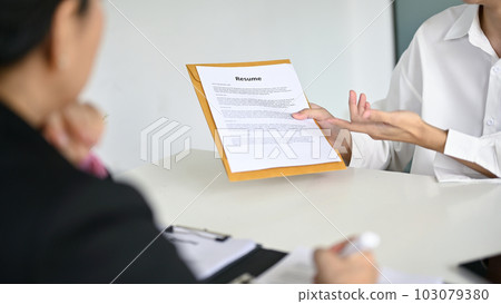 Close-up image of a young male candidate telling about his career experiences 103079380