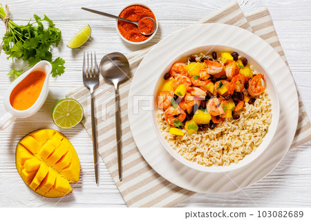 shrimps with beans, mango, brown rice in bowl shrimps with beans, mango, brown rice in bowl 103082689