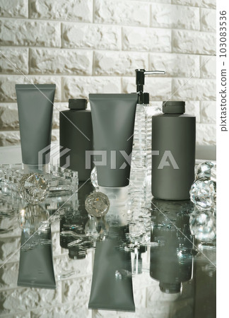 Unbranded blank cosmetics, soap, skincare, cream and shampoo packaging on a fresh background. Skincare female and male skincare products packaging on photo studio Unbranded blank cosmetics, soap, skincare, cream and shampoo packaging on a fresh background. Skincare female and male skincare products packaging on photo studio 103083536