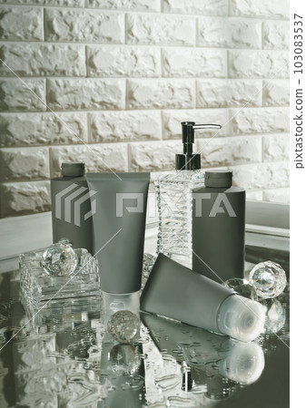 Unbranded blank cosmetics, soap, skincare, cream and shampoo packaging on a fresh background. Skincare female and male skincare products packaging on photo studio Unbranded blank cosmetics, soap, skincare, cream and shampoo packaging on a fresh background. Skincare female and male skincare products packaging on photo studio 103083537