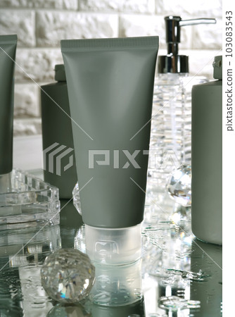 Unbranded blank cosmetics, soap, skincare, cream and shampoo packaging on a fresh background. Skincare female and male skincare products packaging on photo studio Unbranded blank cosmetics, soap, skincare, cream and shampoo packaging on a fresh background. Skincare female and male skincare products packaging on photo studio 103083543