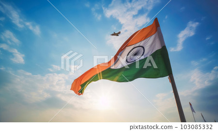 The National Tricolor Flag of India is waving against a blue sky. Banner for Indian Independence Day national holiday 103085332
