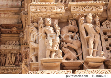Decorative wall carving ornament with figurine of mythical character, demon, elephant, griffin. Western Temples in Khajuraho (Temples of love), India. Unesco World Heritage Site Decorative wall carving ornament with figurine of mythical character, demon, elephant, griffin. Western Temples in Khajuraho (Temples of love), India. Unesco World Heritage Site 103086018