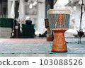 Djembe Drum Djembe Drum is a traditional African musical instrument, standing on a summer terrace in Indonesia 103088526