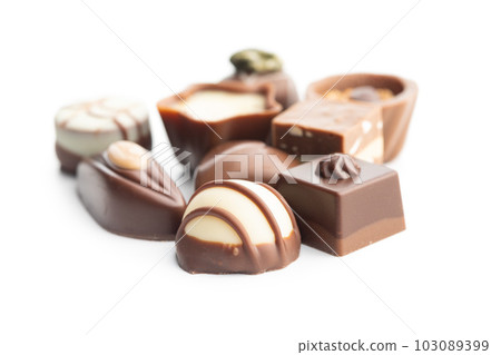 Sweet chocolate pralines. Tasty chocolate truffles isolated on white background. Sweet chocolate pralines. Tasty chocolate truffles isolated on white background. 103089399