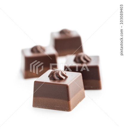 Sweet chocolate pralines.  Tasty chocolate truffles isolated on white background. 103089403