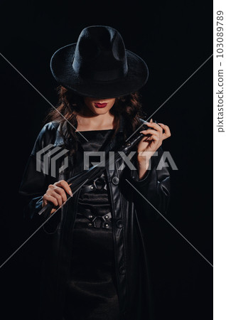 Sexy female dominant mistress with a whip for BDSM sex with submission and domination Sexy female dominant mistress with a whip for BDSM sex with submission and domination 103089789