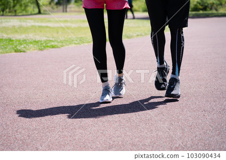 couple running in the park couple running in the park 103090434