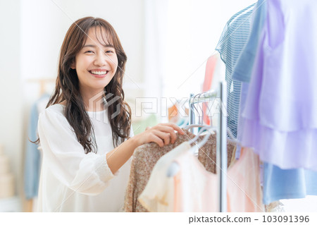 young woman shopping in a store young woman shopping in a store 103091396
