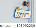 A sign for summer on the doorknob 103092239