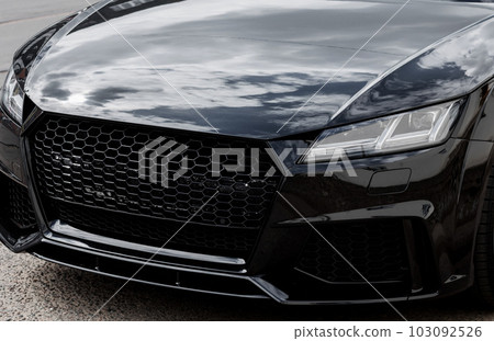 Modern car headlight close up 103092526