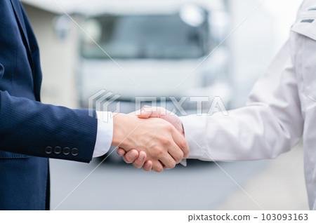 Businessman and truck driver shaking hands Businessman and truck driver shaking hands 103093163