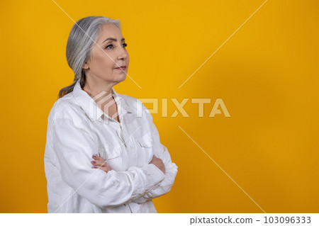 Positive and determined senior woman in light shirt Positive and determined senior woman in light shirt 103096333